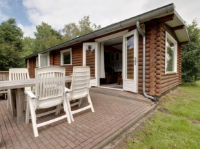 Wooden tree trunk bungalow at fish pond in Hoge Hexel optional with hot tub